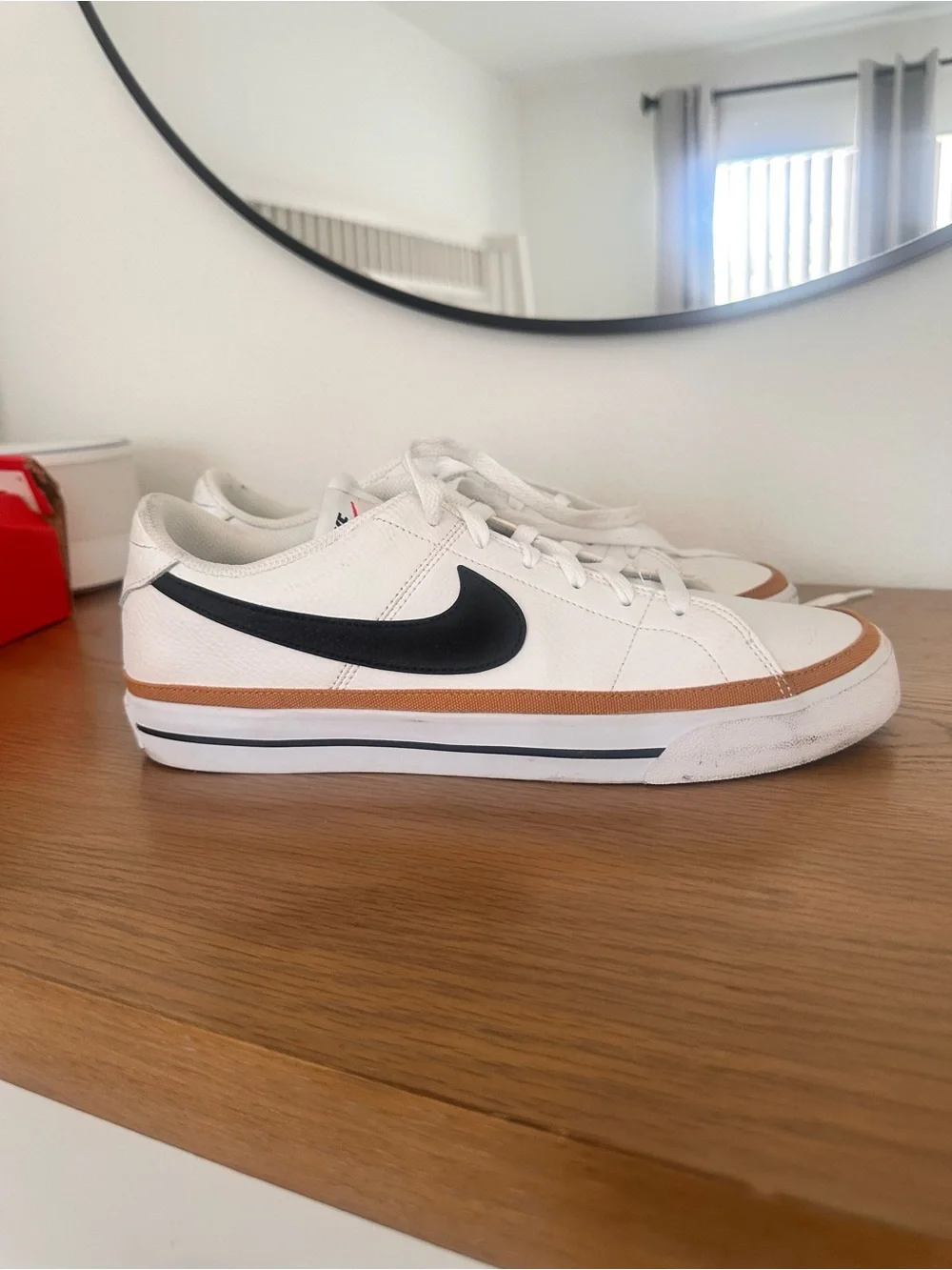 Nike White Low-Top Sneakers with Black Swoosh and Brown Trim